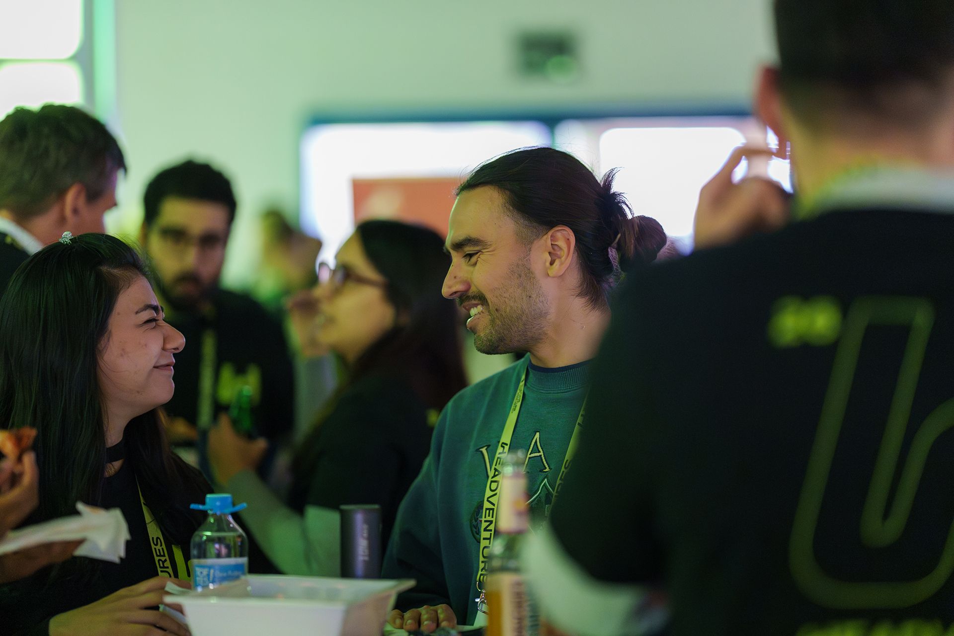 Two participants engaged in a lighthearted conversation while networking at a Headventures startup event